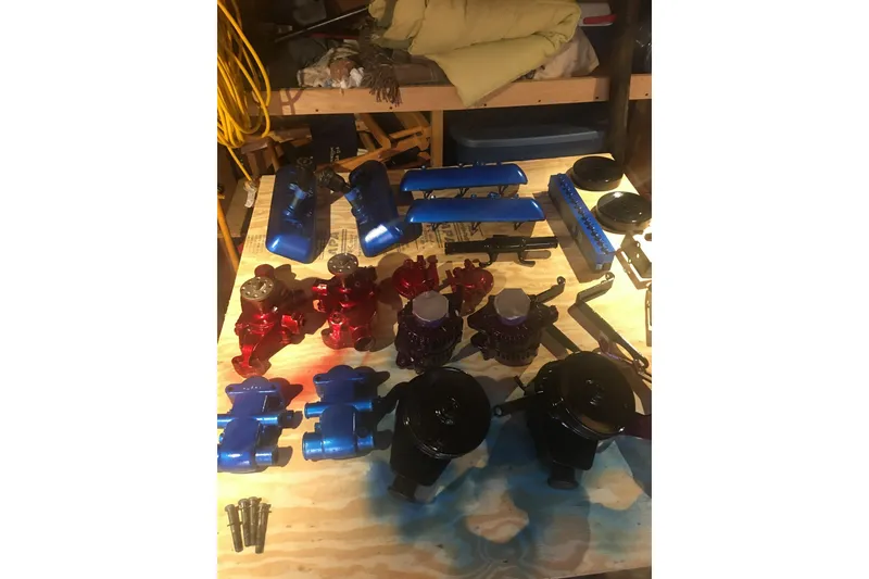 Slide: The Image of Colorful engine parts for 2001 Regal Commodore 2760 on a workbench. - 24