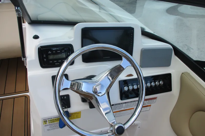 Slide: The Image of Steering console of 2020 NauticStar 2302 Legacy Dual Console boat with controls and display. - 16