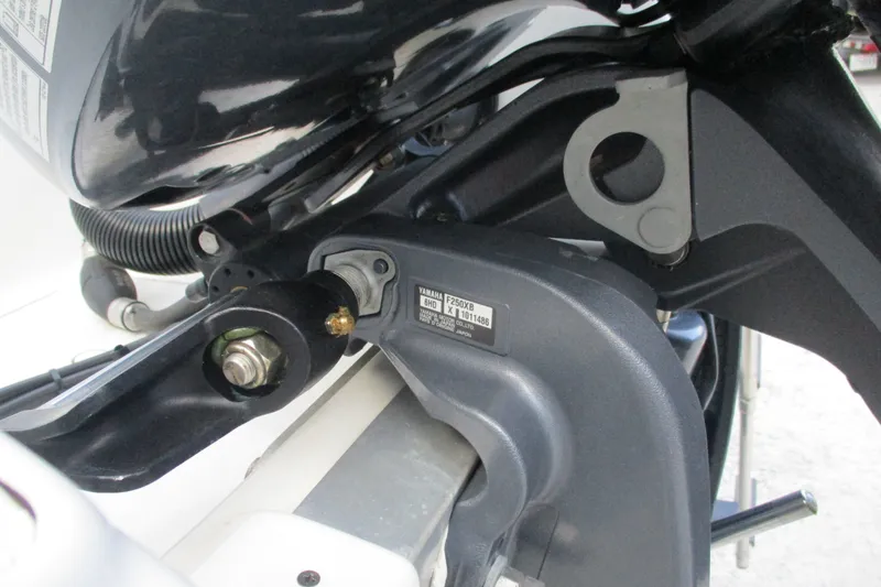 Slide: The Image of Close-up of Yamaha F250XB engine part on 2020 NauticStar 2302 Legacy Dual Console boat. - 19