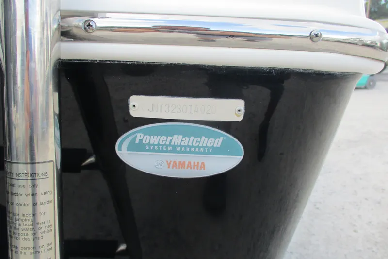 Slide: The Image of 2020 NauticStar 2302 Legacy Dual Console with Yamaha PowerMatched warranty badge. - 18
