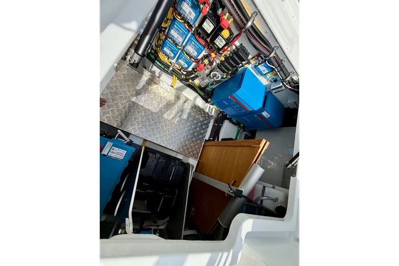 Slide: The Image of Engine compartment of 2027 Targa 32 boat with electrical components and wiring. - 44