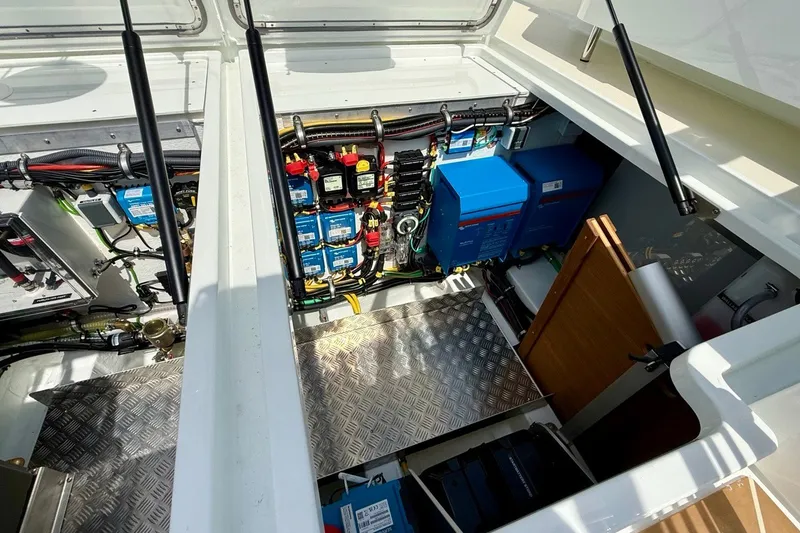 Slide: The Image of Engine compartment of a 2027 Targa 32 boat, showcasing electrical systems and components. - 46