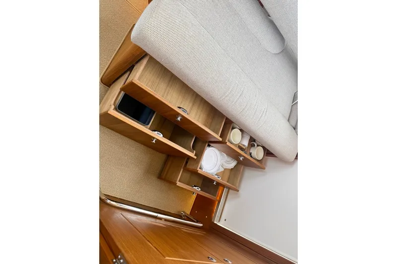 Slide: The Image of Interior of 2027 Targa 32 boat with open wooden storage compartments. - 41