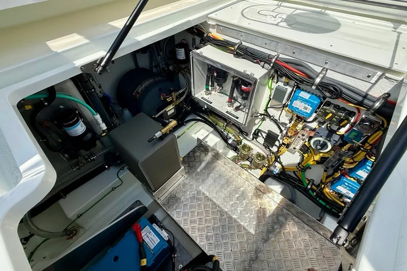 Slide: The Image of Engine compartment of 2027 Targa 32 boat, showcasing advanced wiring and mechanical components. - 43