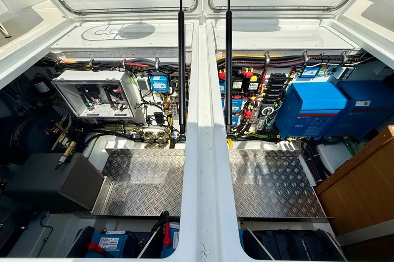 Slide: The Image of Engine compartment of a 2027 Targa 32 boat, showcasing electrical systems and components. - 45