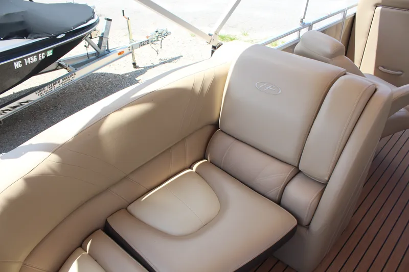 Slide: The Image of Luxurious seating on 2018 Harris Solstice 240 pontoon boat with tan upholstery. - 11