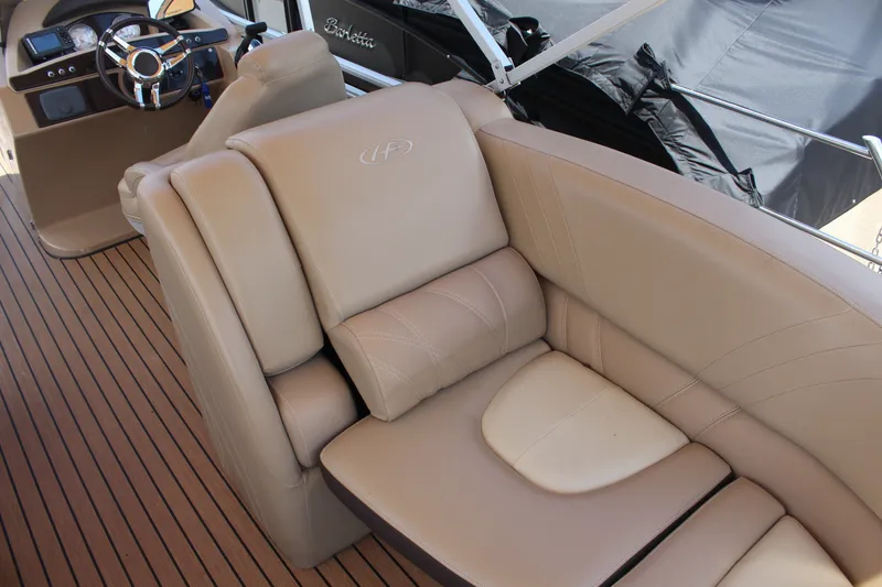 Slide: The Image of Luxurious interior of 2018 Harris Solstice 240 boat with beige leather seating. - 10