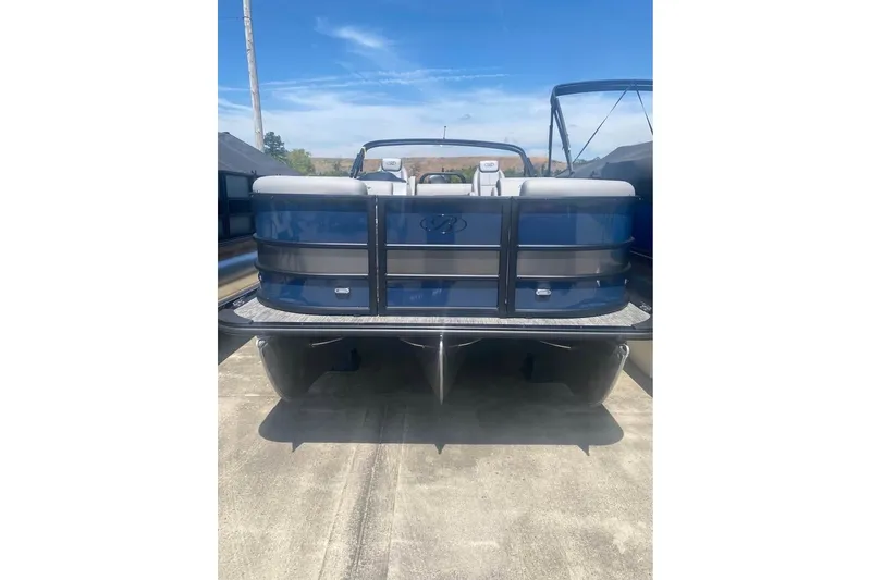The Image of 2026 Bentley Pontoons Legacy 223 Swingback, blue pontoon boat, rear view under clear sky. - 0