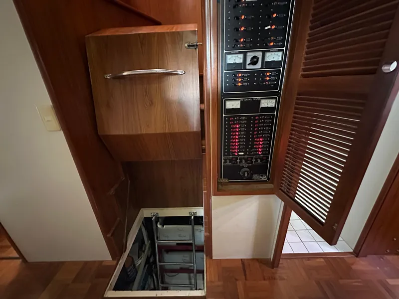 Slide: The Image of Electrical panel and storage area inside a 1997 Kadey-Krogen 48 Whaleback yacht. - 37