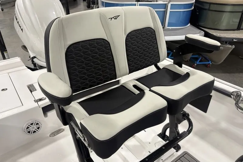 Slide: The Image of 2026 Tidewater 2300 Carolina Bay boat seating with black and white cushioned design. - 29