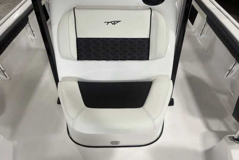 Slide: The Image of 2026 Tidewater 2300 Carolina Bay boat seat with black and white upholstery. - 26