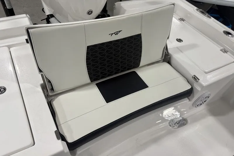 Slide: The Image of 2026 Tidewater 2300 Carolina Bay boat seat with black and white upholstery design. - 23