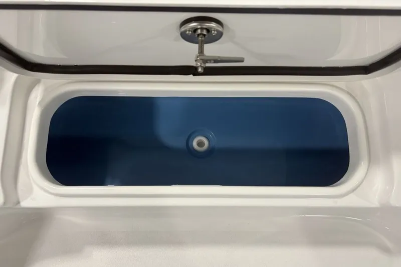 Slide: The Image of Livewell of 2026 Tidewater 2300 Carolina Bay boat, featuring a sleek blue interior. - 22