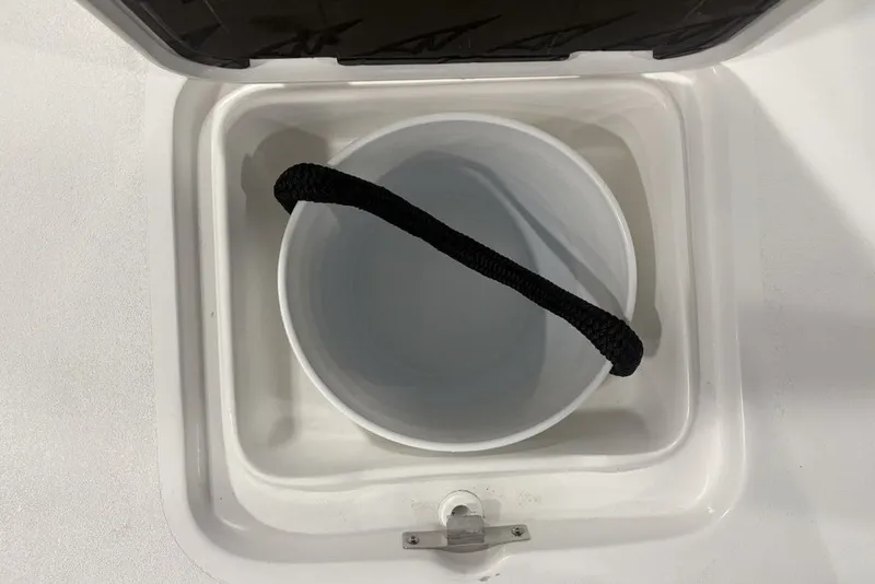 Slide: The Image of Storage compartment with bucket on 2026 Tidewater 2300 Carolina Bay boat. - 25
