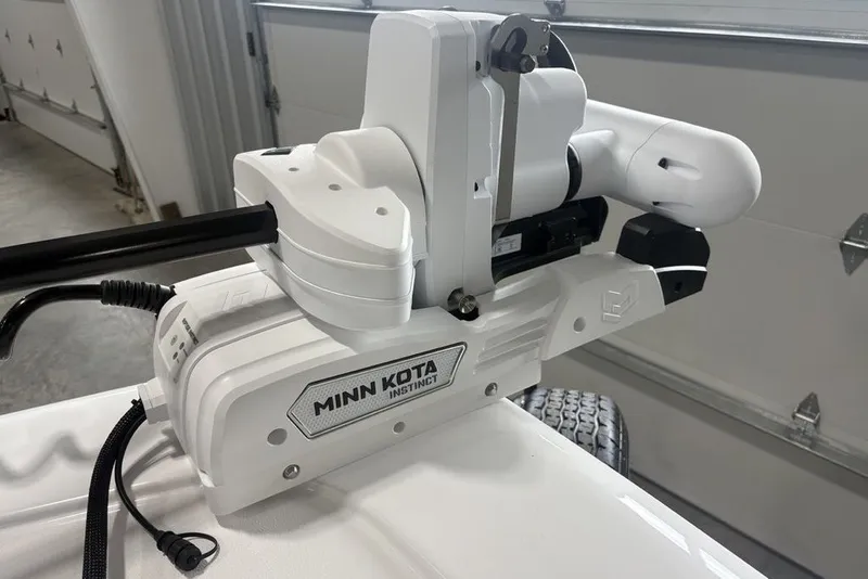 Slide: The Image of Minn Kota Instinct trolling motor on 2026 Tidewater 2300 Carolina Bay boat. - 2