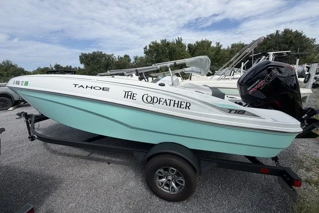Slide: The Image of 2025 Tahoe T18 boat named "The Codfather" on a trailer, featuring a sleek design. - 6