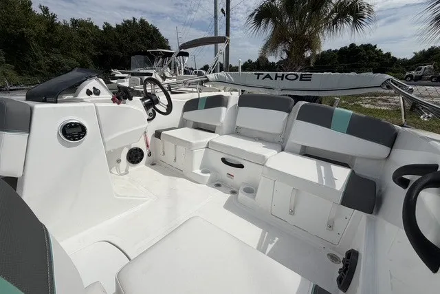 Slide: The Image of 2025 Tahoe T18 boat interior with seating, steering wheel, and storage compartments. - 9