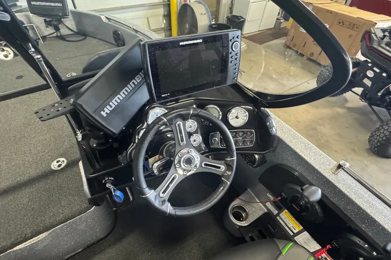 Slide: The Image of 2021 Nitro ZV19 Sport boat dashboard with Humminbird electronics and steering wheel. - 6