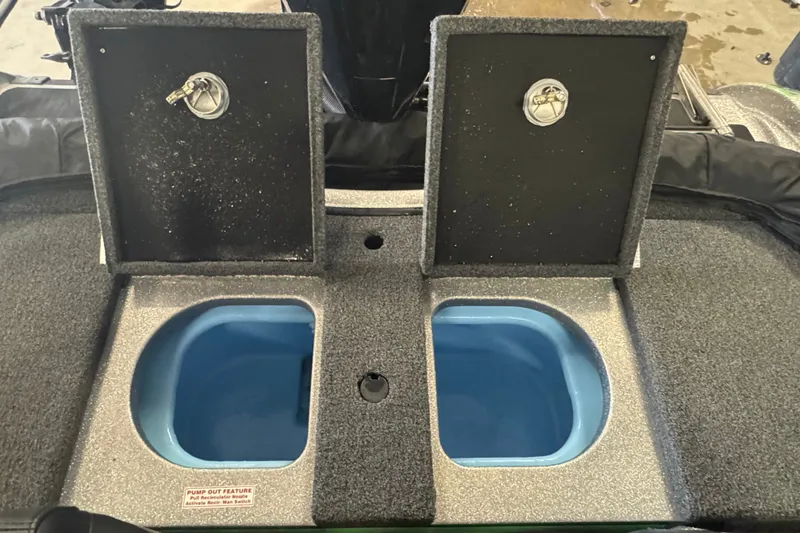 Slide: The Image of 2021 Nitro ZV19 Sport boat livewell compartments with open lids. - 10