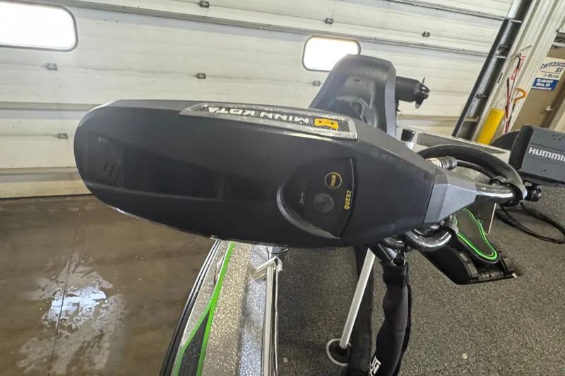 Slide: The Image of 2021 Nitro ZV19 Sport boat with Minn Kota motor in a garage setting. - 15