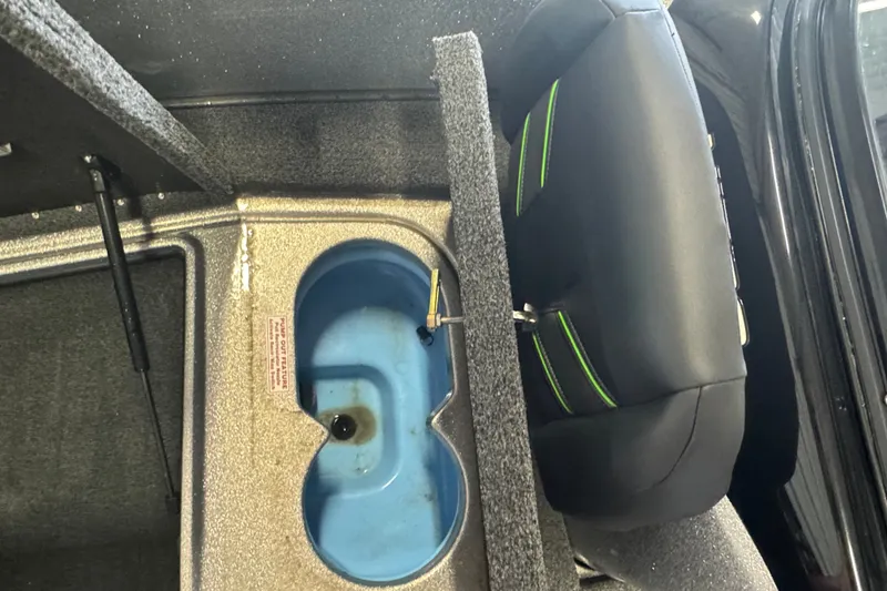 Slide: The Image of 2021 Nitro ZV19 Sport boat interior with storage compartment and seat detail. - 19