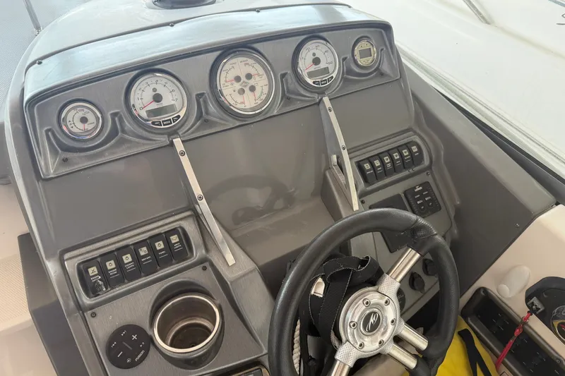 Slide: The Image of Dashboard of a 2011 Monterey 280 SCR boat with gauges and controls. - 21