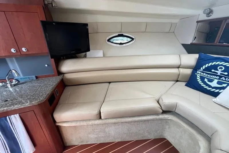 Slide: The Image of Luxurious interior of 2011 Monterey 280 SCR yacht with leather seating and nautical decor. - 17
