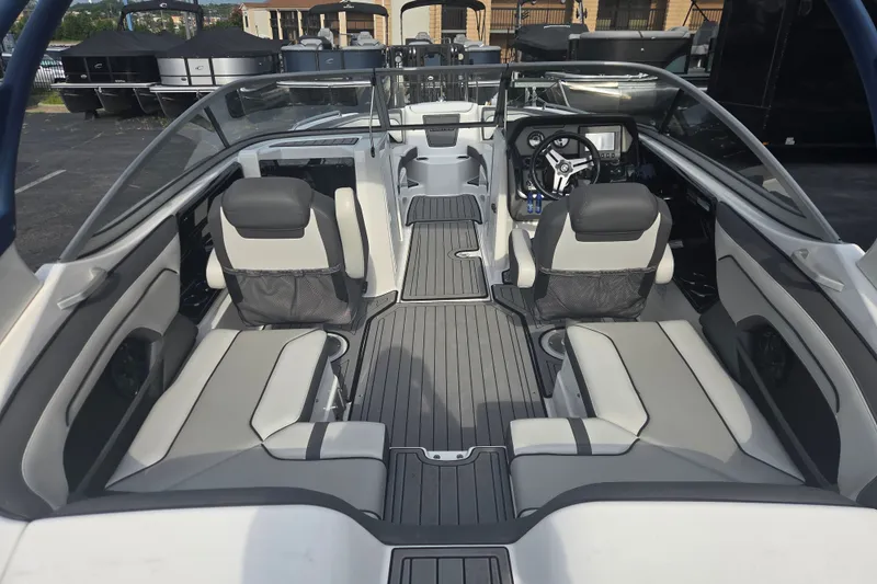 Slide: The Image of 2018 Yamaha Boats 212 Limited S interior with sleek seating and modern dashboard design. - 4