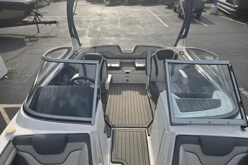 Slide: The Image of 2018 Yamaha Boats 212 Limited S interior with sleek seating and modern design. - 8