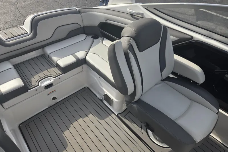 Slide: The Image of 2018 Yamaha Boats 212 Limited S interior seating with gray and white upholstery. - 9