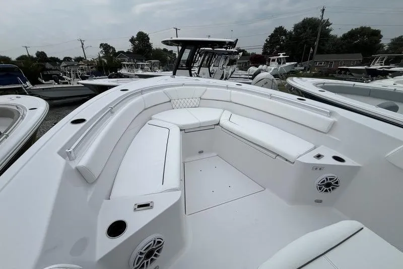 Slide: The Image of 2027 Sportsman Heritage 261 Center Console boat with spacious seating and modern design. - 8