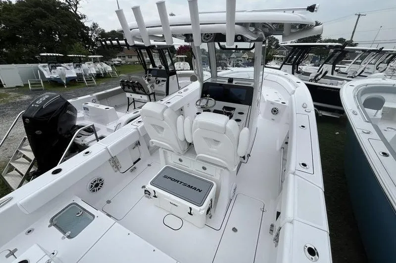 Slide: The Image of 2027 Sportsman Heritage 261 Center Console boat with sleek design and modern features. - 2
