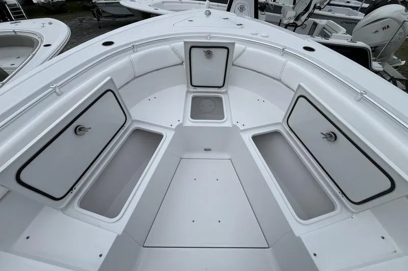 Slide: The Image of 2027 Sportsman Heritage 261 Center Console boat interior with storage compartments. - 9