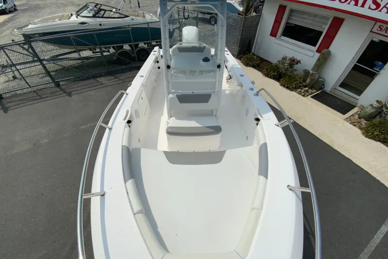 Slide: The Image of 2016 Everglades 230 Center Console boat, white interior, docked near sales office. - 22