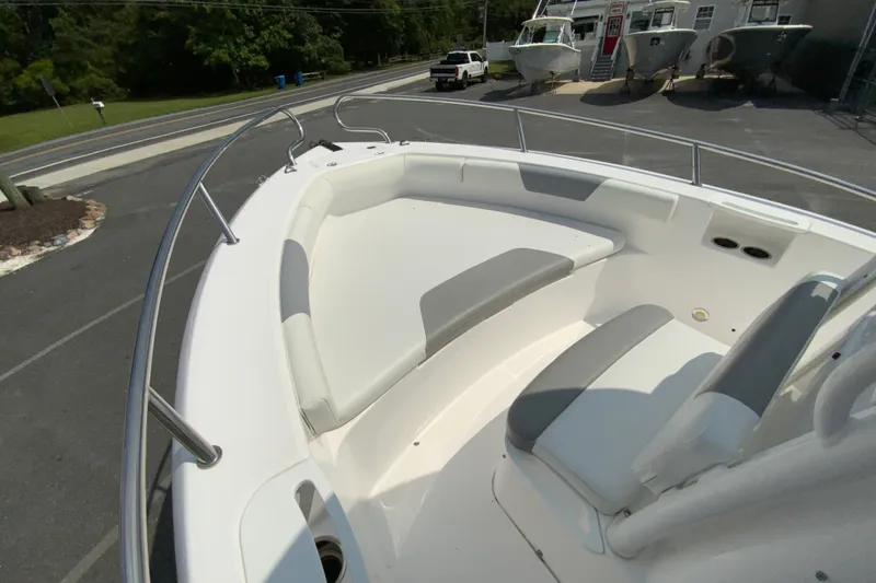 Slide: The Image of 2016 Everglades 230 Center Console boat with spacious seating and sleek design. - 20