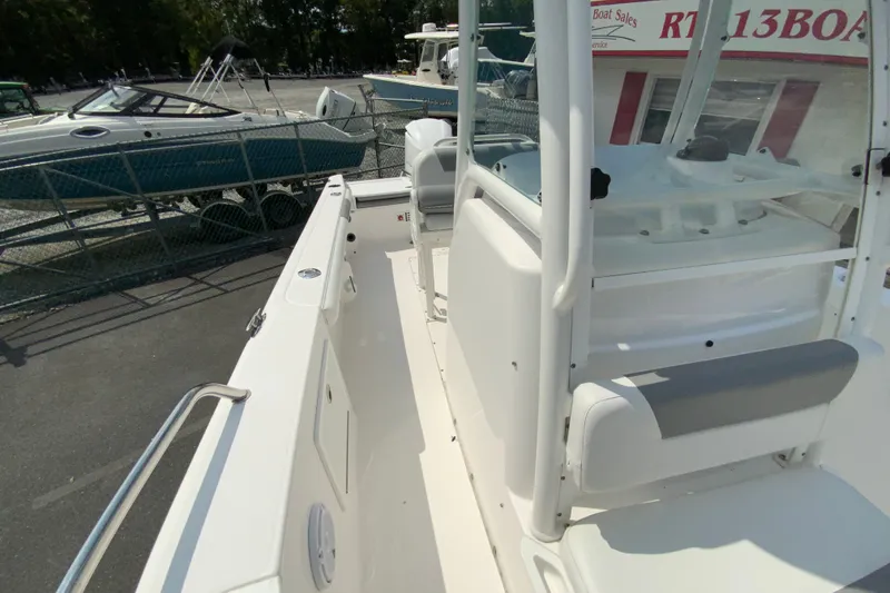 Slide: The Image of 2016 Everglades 230 Center Console boat interior, showcasing seating and console design. - 25