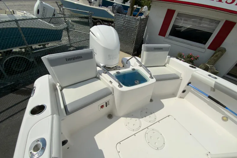 Slide: The Image of 2016 Everglades 230 Center Console boat interior with seating and storage compartments. - 17