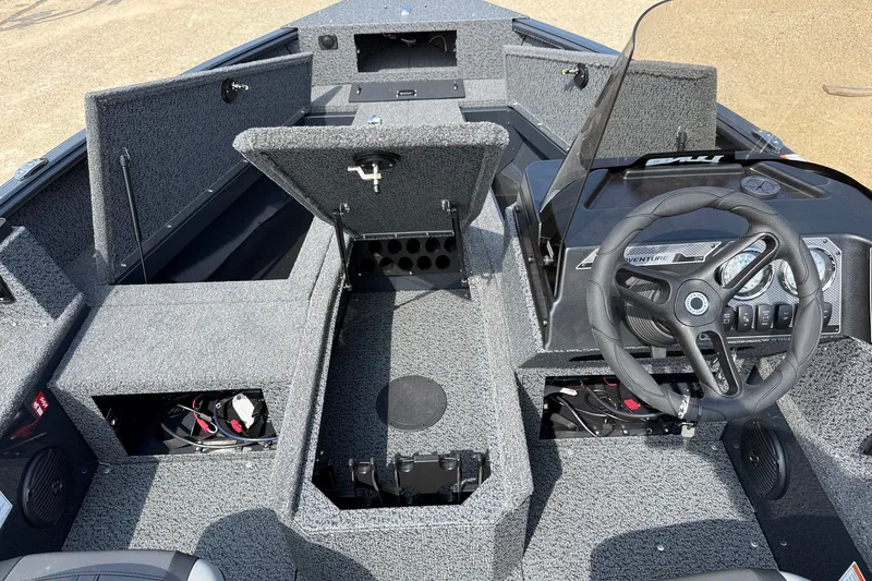 Slide: The Image of Interior view of 2027 Lund 1800 Adventure SS boat with open storage compartments. - 6