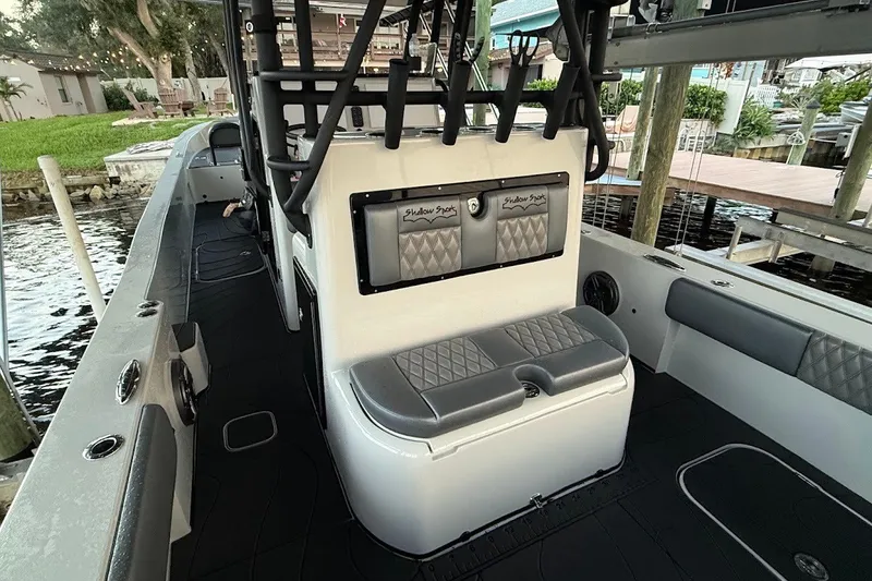 Slide: The Image of 2025 Shallow Sport 32 X3 boat interior with seating and rod holders. - 9