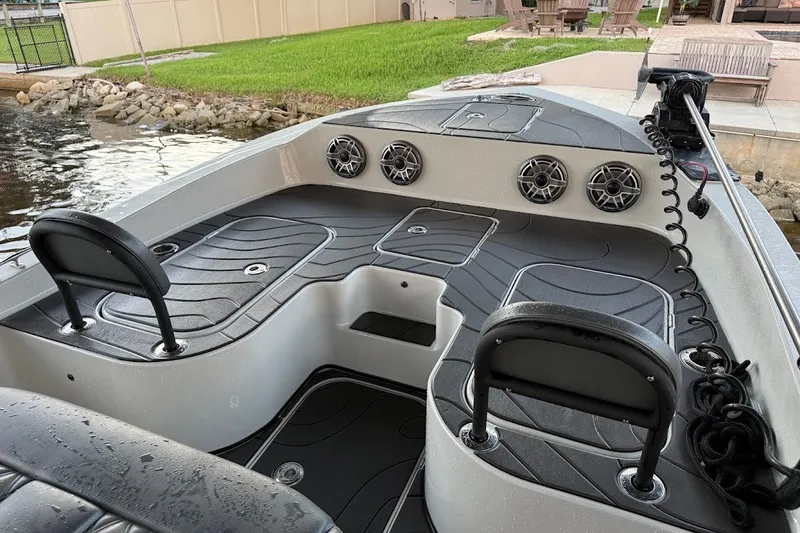 Slide: The Image of 2025 Shallow Sport 32 X3 boat interior with sleek seating and modern design. - 12