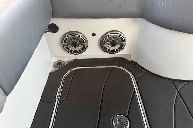 Slide: The Image of Interior of 2025 Shallow Sport 32 X3 boat with speakers and sleek flooring. - 17