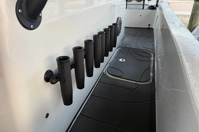 Slide: The Image of Interior view of 2025 Shallow Sport 32 X3 boat with rod holders and non-slip flooring. - 22