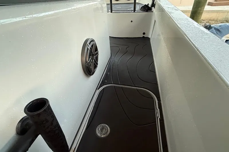 Slide: The Image of 2025 Shallow Sport 32 X3 boat interior with speaker and non-slip flooring. - 11