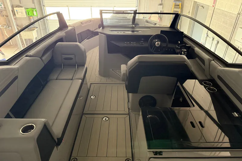 Slide: The Image of Interior of 2026 Yamaha Boats 295XD, featuring sleek seating and modern dashboard design. - 8
