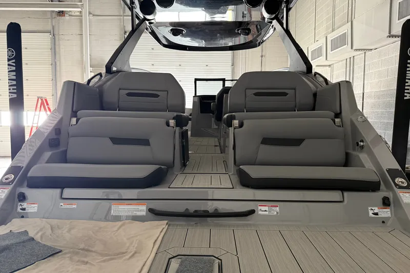 Slide: The Image of 2026 Yamaha Boats 295XD interior with sleek gray seating and modern design. - 2