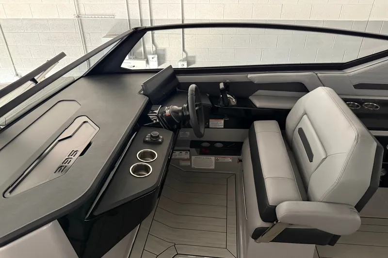 Slide: The Image of 2026 Yamaha Boats 295XD cockpit with modern steering and seating design. - 11