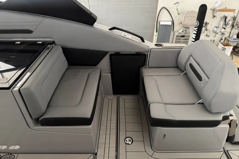 Slide: The Image of Interior seating of 2026 Yamaha Boats 295XD, featuring sleek gray upholstery and modern design. - 6