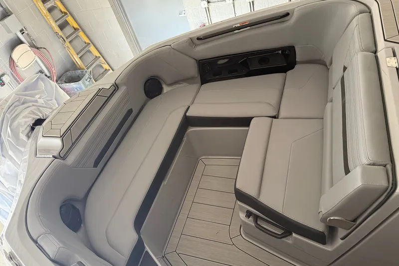 Slide: The Image of Interior of 2026 Yamaha Boats 295XD, featuring sleek gray seating and modern design. - 13