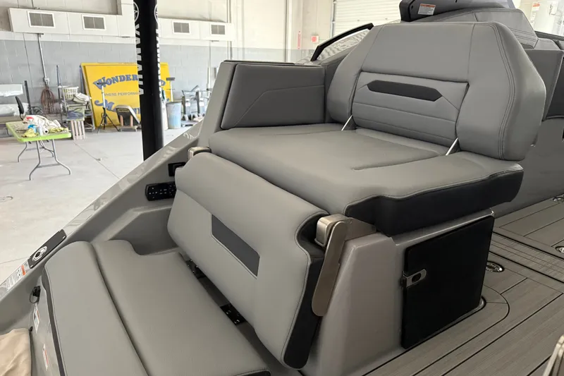 Slide: The Image of 2026 Yamaha Boats 295XD interior seating, featuring sleek gray upholstery and modern design. - 3