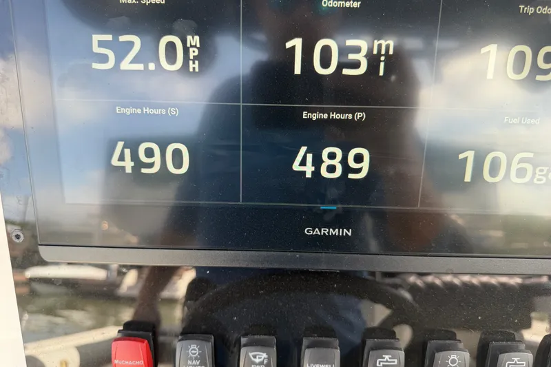 Slide: The Image of Garmin display showing boat stats: 52 MPH max speed, 103 miles odometer, 490 engine hours. - 36